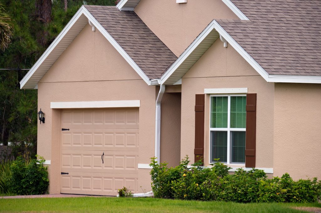 Garage door repair technicians replacing a broken spring in San&nbsp;Mateo