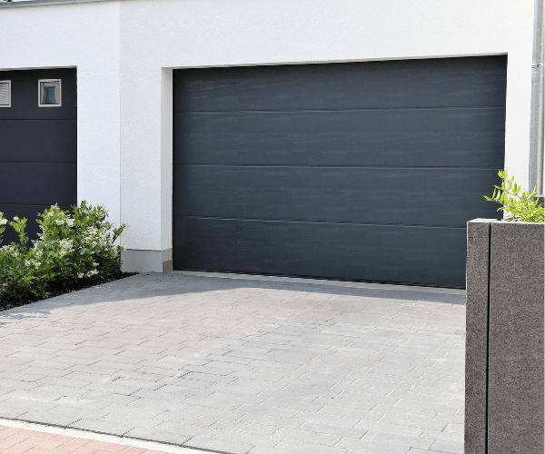 Garage door repair technicians replacing a broken spring in San Bruno