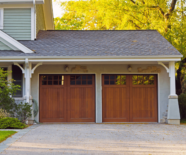 Garage door repair technicians replacing a broken spring in Foster City