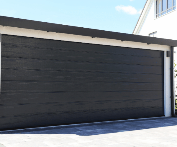 Garage door repair technicians replacing a broken spring in Berkeley