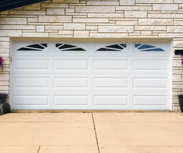 Garage door repair technicians replacing a broken spring in San Bruno